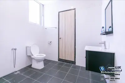 a bathroom with a toilet and a sink at 15BR SwimmingPool Villa Golf View Snooker BBQ in Bayan Lepas