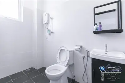 a bathroom with a white toilet and a sink at 15BR SwimmingPool Villa Golf View Snooker BBQ in Bayan Lepas