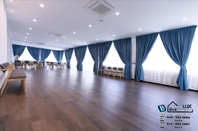 a large room with blue drapes and tables and chairs at 15BR SwimmingPool Villa Golf View Snooker BBQ in Bayan Lepas