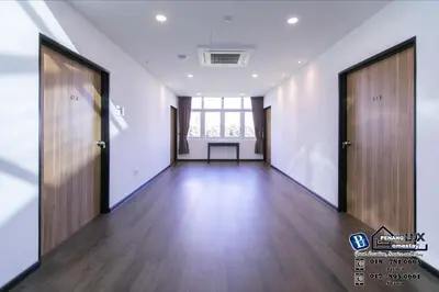 an empty hallway with wooden floors and two doors at 20BR SwimmingPool Villa Golf View Snooker BBQ in Bayan Lepas