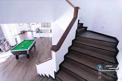 a staircase with a pool table in a living room at 20BR SwimmingPool Villa Golf View Snooker BBQ in Bayan Lepas
