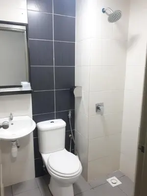 a bathroom with a toilet and a sink at Adsyahrizmal Homestay d'Cameron in Tanah Rata