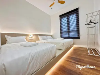two beds in a white room with a window at Sunway Onsen Hotsprings with Ipoh City View, Sunway Lost World in Ipoh