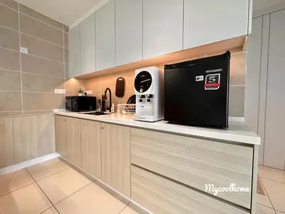 a kitchen with a coffee machine on a counter at Sunway Onsen Hotsprings with Ipoh City View, Sunway Lost World in Ipoh
