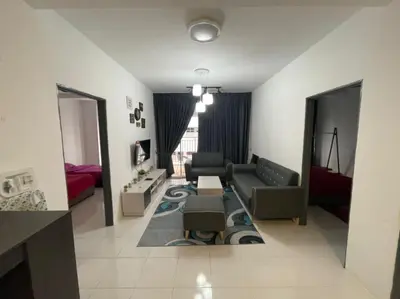 a living room with a couch and a table at Amy Homestay in Brinchang
