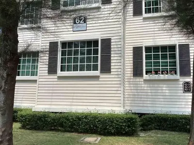 a house with a speed limit sign and two windows at Trails of Kampar Villa Homestay in Kampar