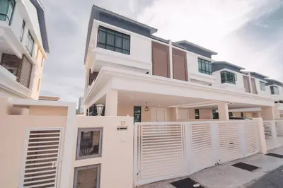 a white house with a fence in front of it at Luxury 3-sty semi-D 5BR 5Bath@Batu Ferringhi 15ppl in Batu Ferringhi