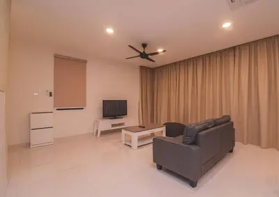 a living room with a couch and a tv at Luxury 3-sty semi-D 5BR 5Bath@Batu Ferringhi 15ppl in Batu Ferringhi