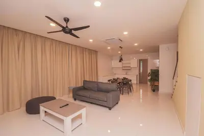 a living room with a ceiling fan and a table at Luxury 3-sty semi-D 5BR 5Bath@Batu Ferringhi 15ppl in Batu Ferringhi