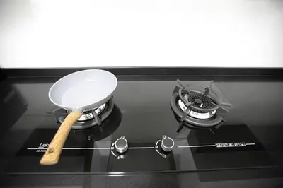 a spatula sitting on top of a stove at Newly Renovated 3Bedroom Vacation Home 6-8pax in Bayan Lepas