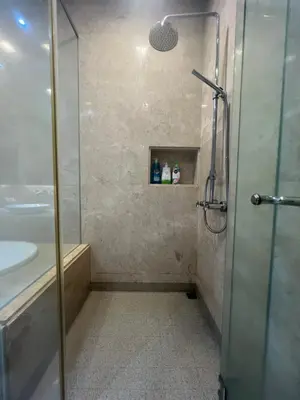 a bathroom with a shower and a sink at 2Beds Seaview Straits Quay comes with Carpark and Hothub in Bagan Jermal