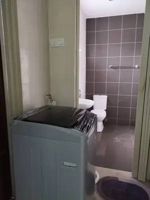 a bathroom with a tub and a toilet and a mirror at Homestay Mohamad & Delisha Tapah -Pool in Tapah