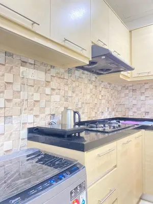 a kitchen with a tea kettle on a stove at Lovely Cozy studio 3pax@mansion one Gurney in George Town