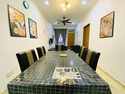 a dining room with a table with chairs and a ceiling fan at Deena's Cottage Homestay Kulim Hitech Hospital Kulim, Three bedrooms Single Storey Terrace House in Kulim