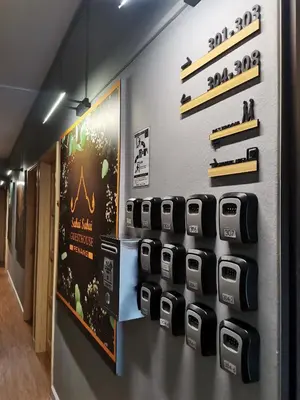a wall with four printers on the wall at Sabai Sabai Guesthouse in Bayan Lepas in Bayan Lepas