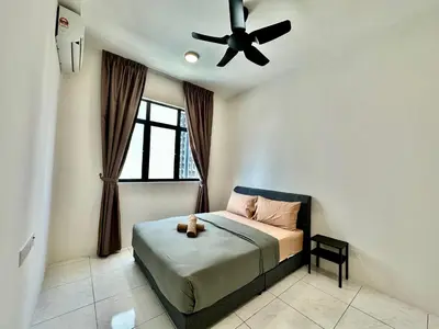 a bedroom with a bed with a ceiling fan at 13A5TheSun#BayanLepas#QueensbayMall#CozyHomestay in Bayan Lepas