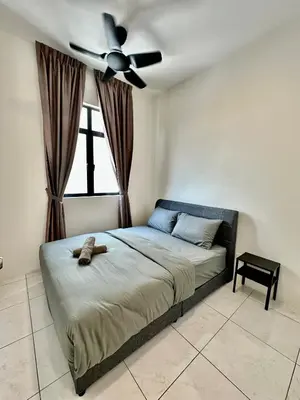 a bedroom with a bed with a ceiling fan at 13A5TheSun#BayanLepas#QueensbayMall#CozyHomestay in Bayan Lepas