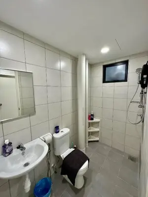 a bathroom with a toilet and a sink and a tv at 13A5TheSun#BayanLepas#QueensbayMall#CozyHomestay in Bayan Lepas