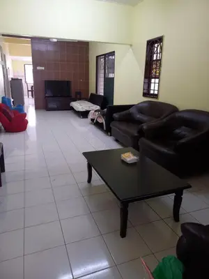 a living room with couches and a coffee table at AB Tambun Homestay in Ipoh
