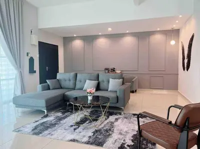 a living room with a blue couch and a table at Sweet HOME FOR BIG Family\uff5c11pax+FREE WIFI in Sitiawan