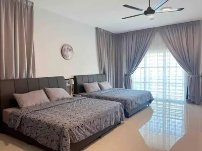a bedroom with two beds and a ceiling fan at Sweet HOME FOR BIG Family\uff5c11pax+FREE WIFI in Sitiawan