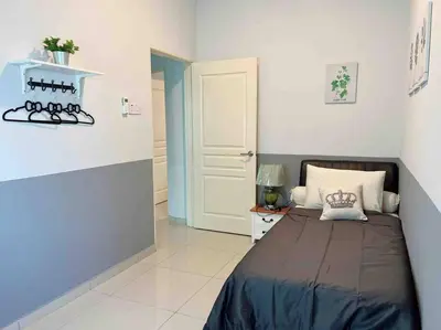 a bedroom with a bed in a room with a door at Sweet HOME FOR BIG Family\uff5c11pax+FREE WIFI in Sitiawan
