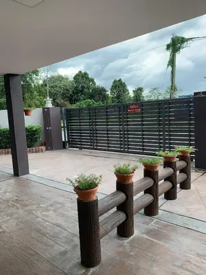 a row of benches with potted plants on them at Lavender house IPOH in Ipoh