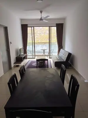 a dining room with a black table and chairs at Cold house in Cameron Highlands