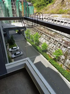 a balcony of a building with a view of a street at Cold house in Cameron Highlands