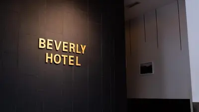 a hotel sign on the wall of a building at Beverly Hotel in Taiping