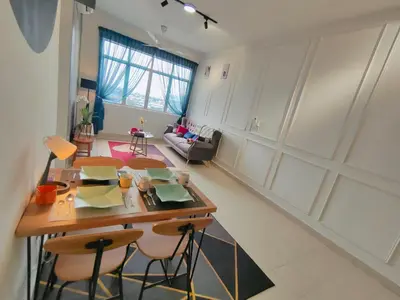 a kitchen and living room with a table and chairs at Desig Classic Falim by irainbow in Ipoh