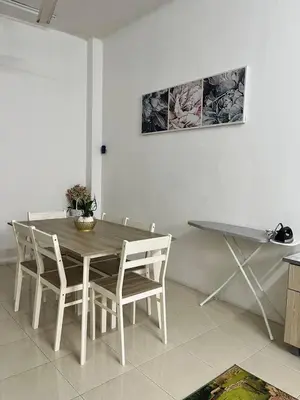 a dining room with a table and chairs at Tapak 173 by Sutera Hōmes in Sungai Petani