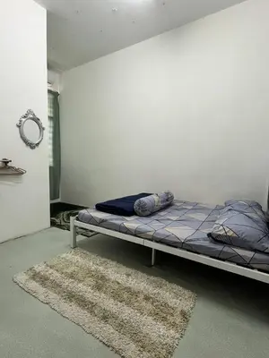 a bedroom with a bed in the corner of a room at Tapak 173 by Sutera Hōmes in Sungai Petani
