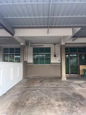 an empty parking lot with a building with windows at Tapak 173 by Sutera Hōmes in Sungai Petani