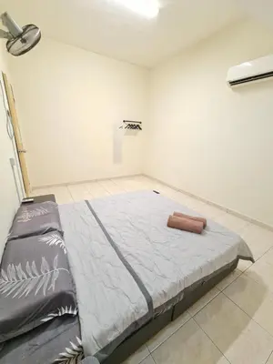 a bedroom with a large bed in a room at Air-home M3 Simpang near Aulong Econsave, 4BR, 10pax, Netflix in Taiping
