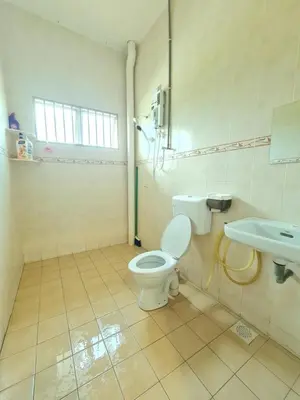 a bathroom with a toilet and a sink at Air-home M3 Simpang near Aulong Econsave, 4BR, 10pax, Netflix in Taiping