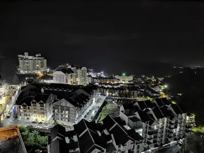 a view of a city at night with buildings at Emerald Avenue Cozy 3R3B Apartment 715 in Brinchang