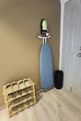a room with a rack of wine bottles on the wall at Emerald Avenue Cozy 3R3B Apartment 715 in Brinchang
