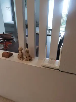 two teddy bears sitting on a shelf with a laptop at Emerald Avenue Cozy 3R3B Apartment 715 in Brinchang