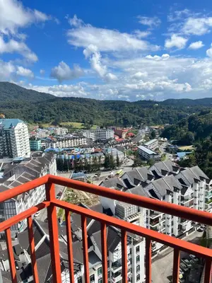 a view of a city from the balcony of a building at Emerald Avenue Cozy 3R3B Apartment 715 in Brinchang