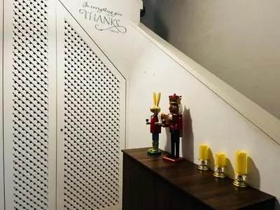 a room with a staircase with a table with candles at Georgetown Kyash House 23 in George Town