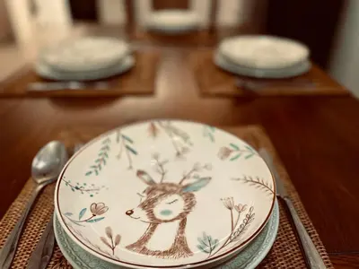 a plate with a deer on it sitting on a table at Georgetown Kyash House 23 in George Town