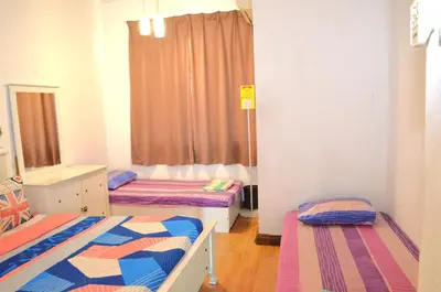 a bedroom with two beds and a window in it at Near Gurney 3-Storey Event Hse by Felice Homestay in Tanjong Tokong
