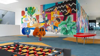 a room with a wall with a mural at Rooftop Pool, Up to 8 Pax, 2 Bedrooms, 2 Bathrooms, 2 Car Parks by Star Home in George Town