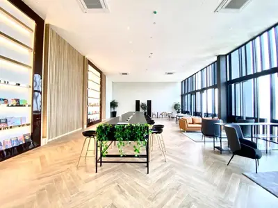 an office lobby with a long table and chairs at Rooftop Pool, Up to 8 Pax, 2 Bedrooms, 2 Bathrooms, 2 Car Parks by Star Home in George Town