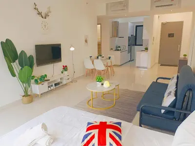 a living room with a couch and a tv and a living room at Rooftop Pool, Up to 8 Pax, 2 Bedrooms, 2 Bathrooms, 2 Car Parks by Star Home in George Town