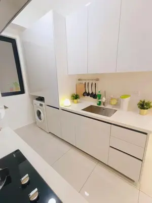 a white kitchen with a sink and a microwave at Rooftop Pool, Up to 8 Pax, 2 Bedrooms, 2 Bathrooms, 2 Car Parks by Star Home in George Town