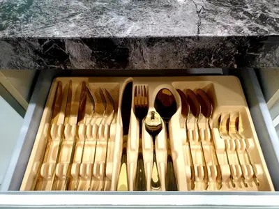 a drawer with forks and spoons and forks and knives at Charming Studio 1BR 1LR Condo Georgetown \u9b45\u529b\u4e00\u5ba4\u4e00\u5385\u5957\u623f in George Town