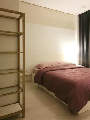 a bedroom with a bed and a book shelf at Charming Studio 1BR 1LR Condo Georgetown \u9b45\u529b\u4e00\u5ba4\u4e00\u5385\u5957\u623f in George Town