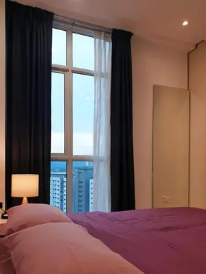 a bedroom with a bed and a large window at Charming Studio 1BR 1LR Condo Georgetown \u9b45\u529b\u4e00\u5ba4\u4e00\u5385\u5957\u623f in George Town